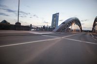 the view of two lanes and the bridge, from behind them on a vehicle's driving