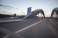 the view of two lanes and the bridge, from behind them on a vehicle's driving