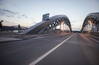 the view of two lanes and the bridge, from behind them on a vehicle's driving