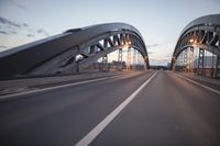 the view of two lanes and the bridge, from behind them on a vehicle's driving