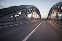 the view of two lanes and the bridge, from behind them on a vehicle's driving