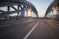 the view of two lanes and the bridge, from behind them on a vehicle's driving