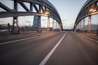 the view of two lanes and the bridge, from behind them on a vehicle's driving