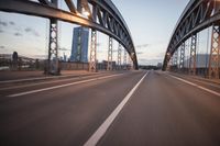 the view of two lanes and the bridge, from behind them on a vehicle's driving