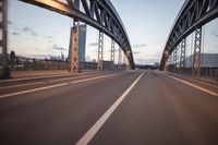 the view of two lanes and the bridge, from behind them on a vehicle's driving