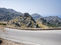 Mountain Landforms on Highway under Clear Sky