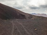 Mountain Landscape: Dirt Road with Asphalt Surface