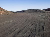 Mountain Landscape: Dirt Road, Grass, and Slope