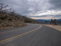 Mountain Overlook: A Gloomy View Under a Grey Sky