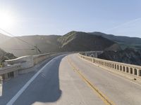 Mountain Road: Asphalt Underneath a Clear Sky