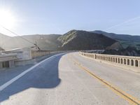 Mountain Road: Asphalt Underneath a Clear Sky