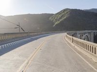 Mountain Road: Asphalt Underneath a Clear Sky