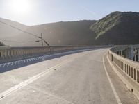 Mountain Road: Asphalt Underneath a Clear Sky