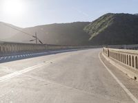 Mountain Road: Asphalt Underneath a Clear Sky