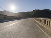 Mountain Road: Asphalt Underneath a Clear Sky