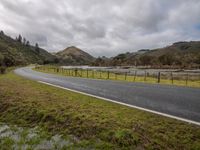 Mountain Road: Curving through a Gloom with Grey Sky