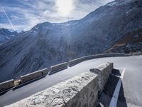 a man is riding his bike down the mountain road side view taken from low angle