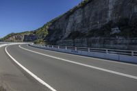 Mountain Road: Exploring Nature Under a Clear Sky