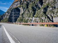 Mountain Road View in Italy - Scenic Landscape with Contrails