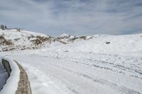 a snowboarder is going down the snow on a steep slope in the mountains