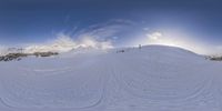 the snowboarder is riding along the mountain slope in full view 360 - angle