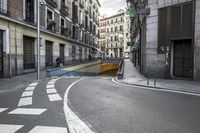 a very narrow street is seen in this photo from the camera's point - view