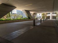 a walkway that looks very narrow and empty with benches outside in it, which has been painted silver