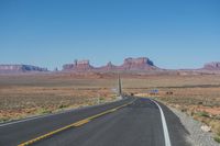 National Park: Clear Sky, Red Rock, and a Scenic Highway