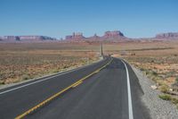 National Park: Clear Sky, Red Rock, and a Scenic Highway