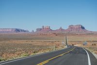 National Park: Clear Sky, Red Rock, and a Scenic Highway