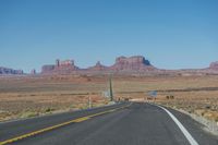 National Park: Clear Sky, Red Rock, and a Scenic Highway