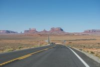 National Park: Clear Sky, Red Rock, and a Scenic Highway