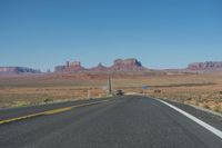 National Park: Clear Sky, Red Rock, and a Scenic Highway