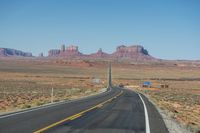 National Park: Clear Sky, Red Rock, and a Scenic Highway