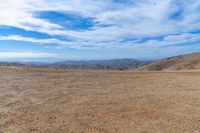 Nature's Overlook: Sand, Dirt, and Grassy Surfaces