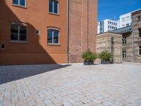 this brick courtyard is very neat and neat for use in an urban setting as well as surrounding buildings