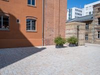 this brick courtyard is very neat and neat for use in an urban setting as well as surrounding buildings