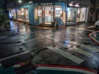 a bus is parked in front of a pharmacy on the street while rain starts to fall