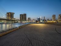 a big city has a nice park by the water at dusk, a long exposure shot