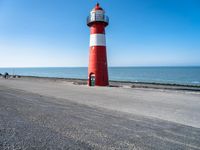 Netherlands: Lighthouse by the Beach Overlooking the Ocean