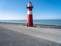 Netherlands: Lighthouse by the Beach Overlooking the Ocean