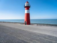 Netherlands: Lighthouse by the Beach Overlooking the Ocean