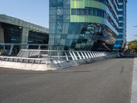 the modern looking building has been designed to look like an upside down bridge between two other skyscrapers