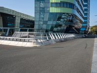 the modern looking building has been designed to look like an upside down bridge between two other skyscrapers