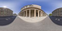 360 - 360 image of a view of the building in the street with columns on it