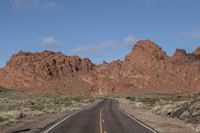 Nevada Desert Road: Asphalt Cutting Through Red Rocks