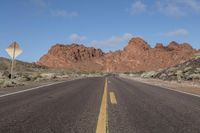 Nevada Desert Road: Asphalt Cutting Through Red Rocks