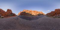 an image of a panoramic view of a road with a vehicle going through it