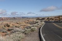 the road curves into a narrow desert area, and is mostly empty due of snow