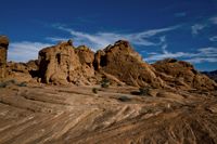 the desert in nevada features many rock formations and arid terrains with various species in the area